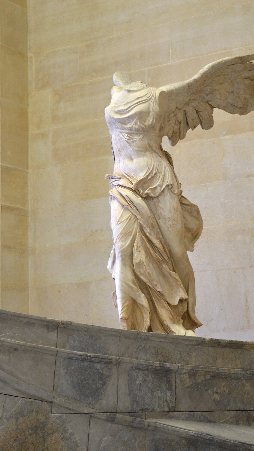 The Winged Victory of Samothrace, its wind-blown drapery describing the body beneath